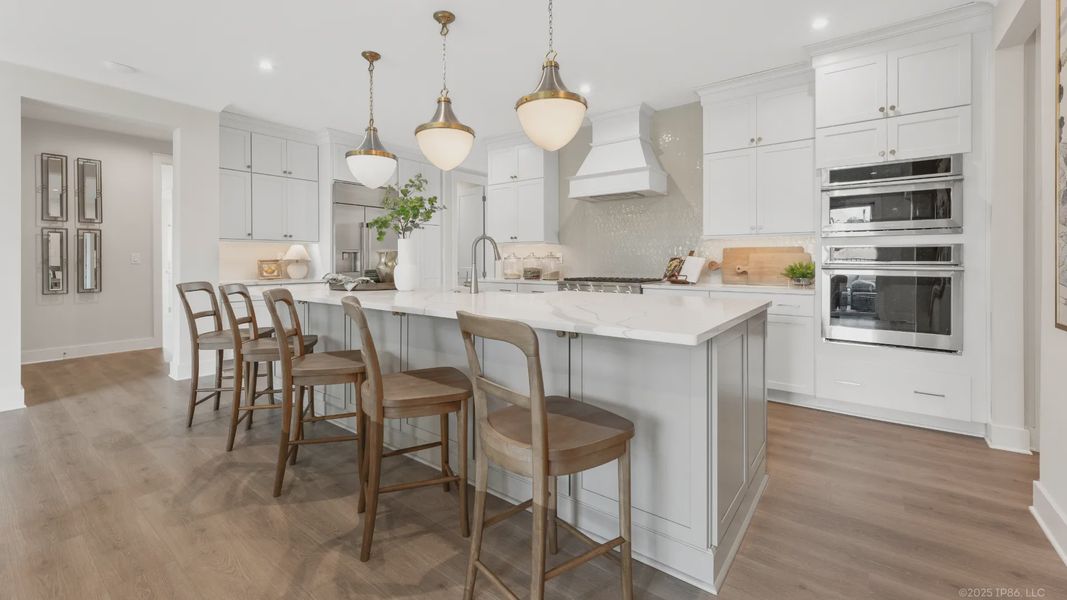 Furnished interior in a model home at The Courtyards by The Manor in Alpharetta (Image 7).