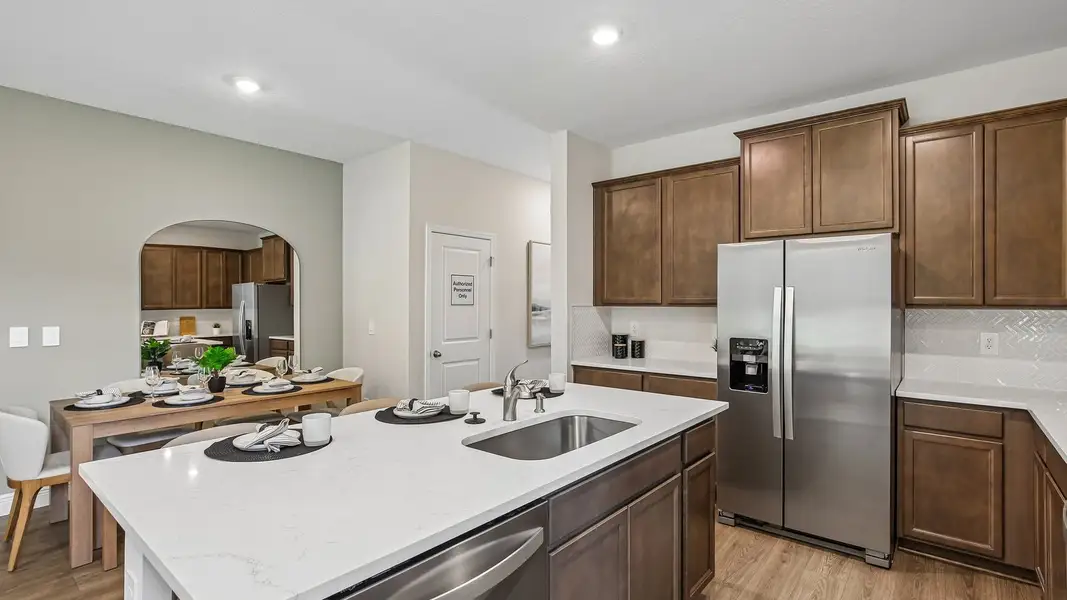 Furnished interior in a model home at Sanctuary at Citrus Park Townhomes in Tampa (Image 7).