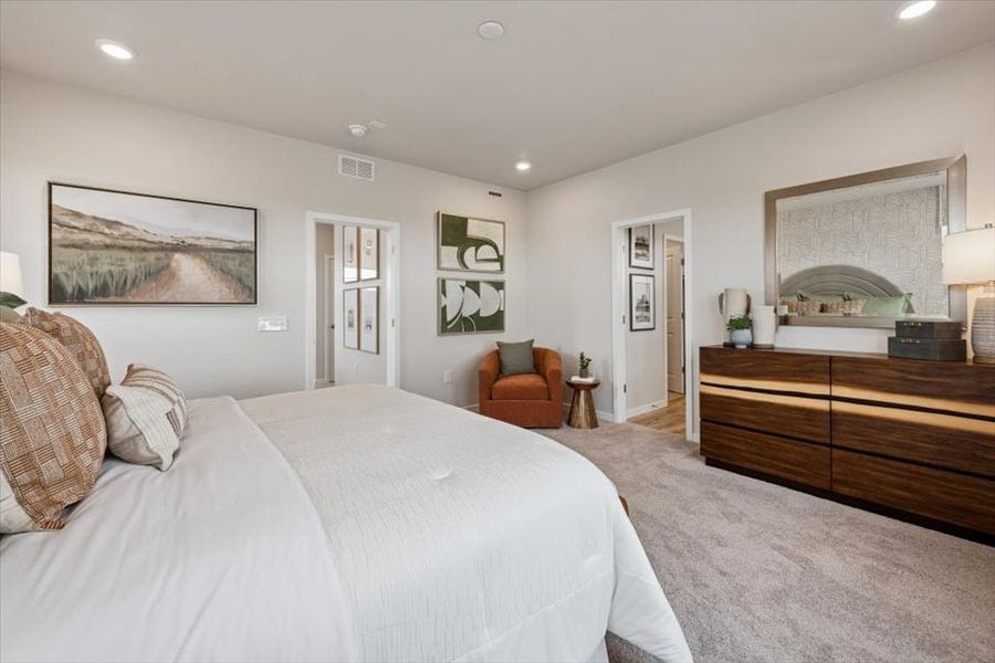 A bedroom with a bed and a desk. A bedroom with a bed and a desk.