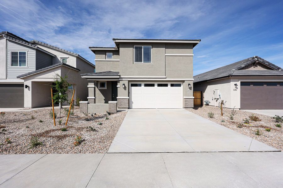 A driveway leading to a house. A driveway leading to a house.