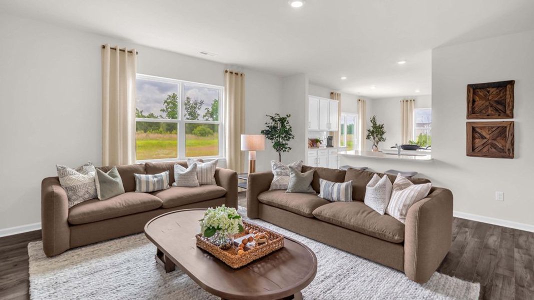 Furnished interior in a model home at Shahbain Reserve in Raeford (Image 6).
