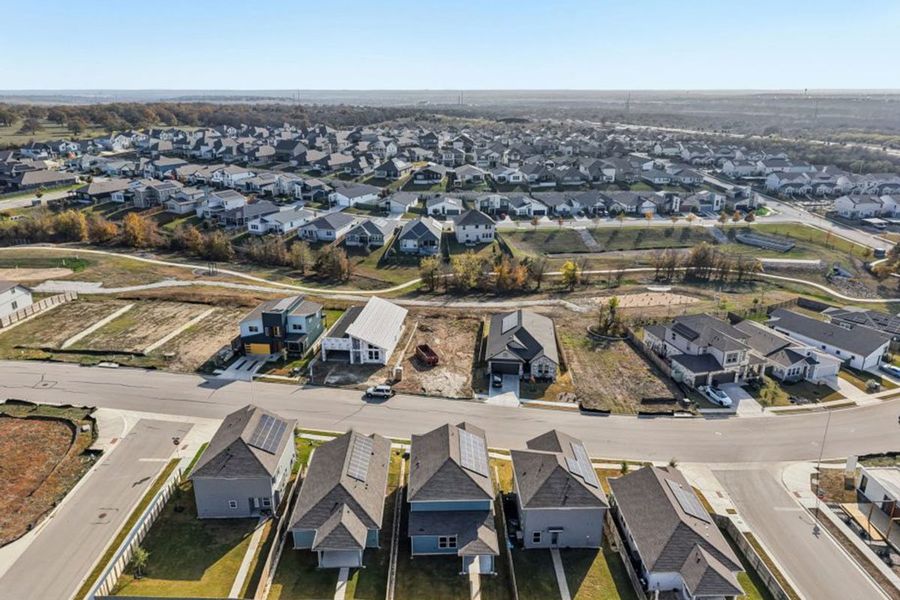 Aerial view of the Whisper Valley community in Manor, TX, showing layout and nearby surroundings (Image 1). Aerial view of the Whisper Valley community in Manor, TX, showing layout and nearby surroundings (Image 1).