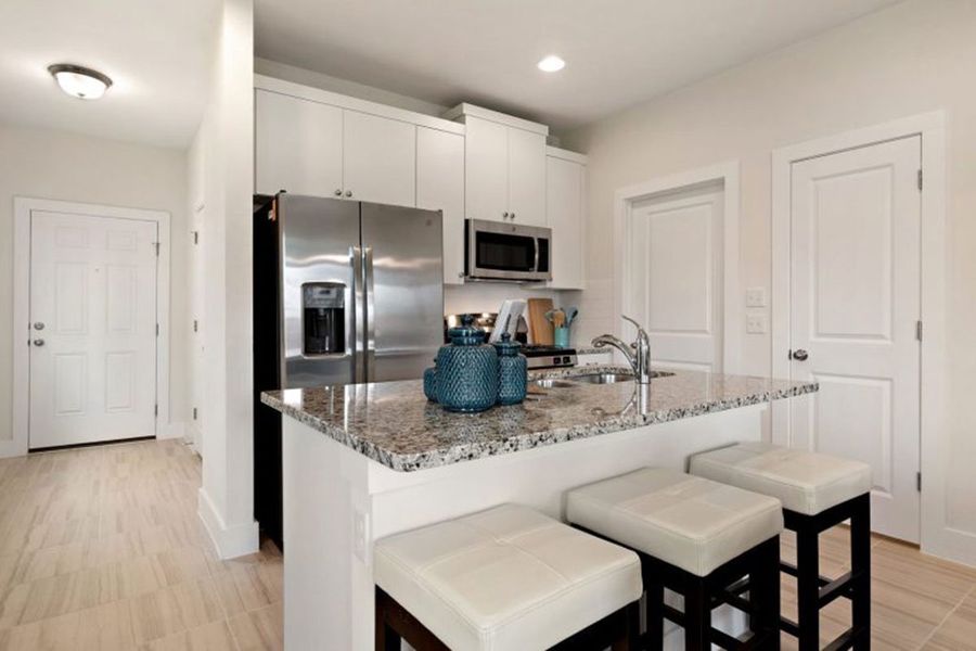Furnished interior in a model home at Saddle Creek Twinhomes in Georgetown (Image 19).