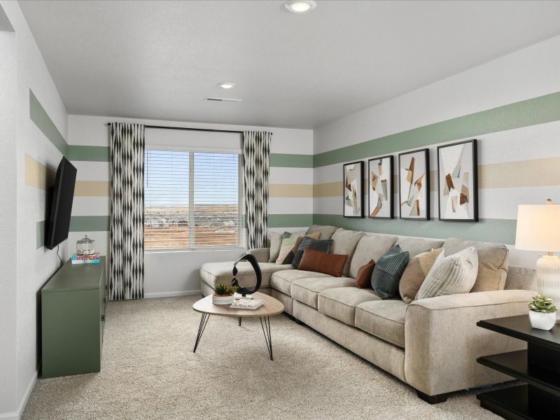 Furnished interior in a model home at Frontier Estates - The Trails Collection in Firestone (Image 14).