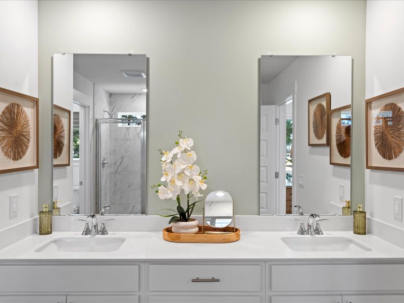 The primary ensuite boasts duel sinks, tile shower and large walk-in closet.