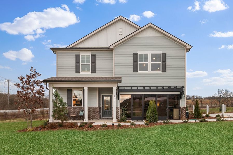 A house with a lawn in front. A house with a lawn in front.