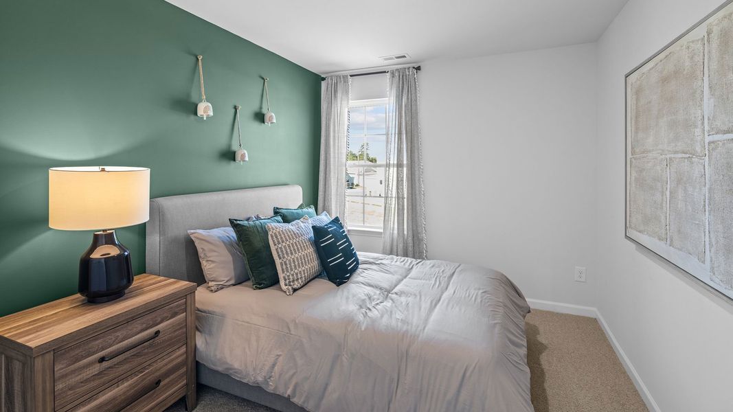 Furnished interior in a model home at The Townes at Ridgewood Farms in Winterville (Image 9).