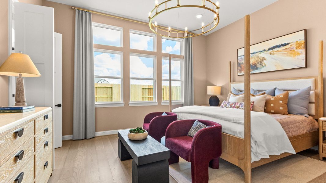 Beautifully designed bedroom with large windows natural light and a bright refined aesthetic