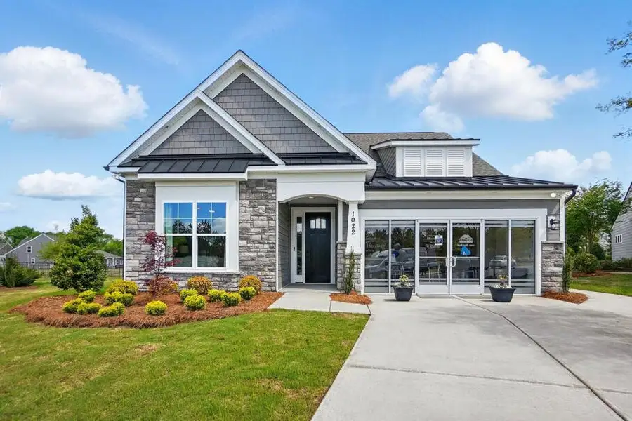 Front exterior of a home in the Heritage - 55+ Community community, located in Indian Trail, NC (Image 3). Front exterior of a home in the Heritage - 55+ Community community, located in Indian Trail, NC (Image 3).