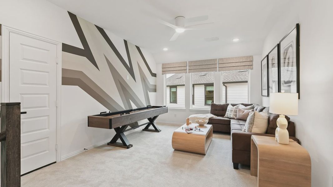 Experience elegance with a zigzag accent wall and sleek shuffleboard in Katy Lakes. Experience elegance with a zigzag accent wall and sleek shuffleboard in Katy Lakes.