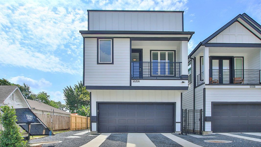 Elegant detached townhome with modern facade and private balcony in Shady Acres, Houston.