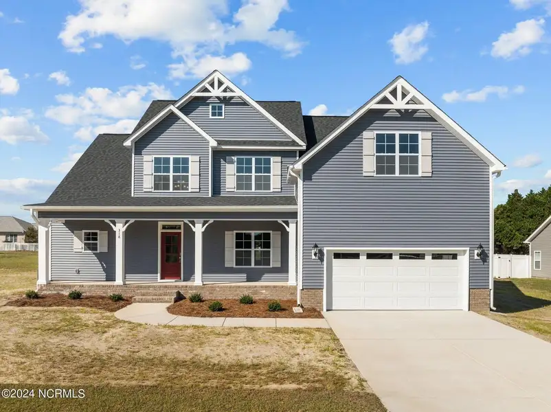 Front exterior of a home in the Kennedy's Crossing community, located in Grimesland, NC (Image 1).