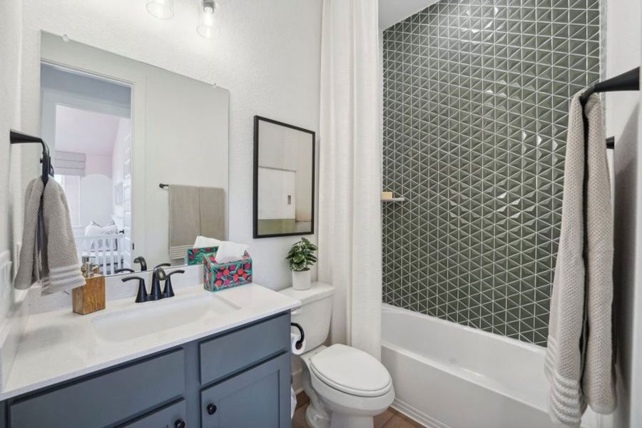 Furnished interior in a model home at Grande Estates in Bertram (Image 13).