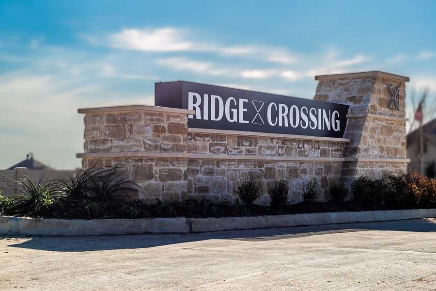 Entrance to the Ridge Crossing community in Waxahachie, TX, featuring signage and landscaping (Image 1).