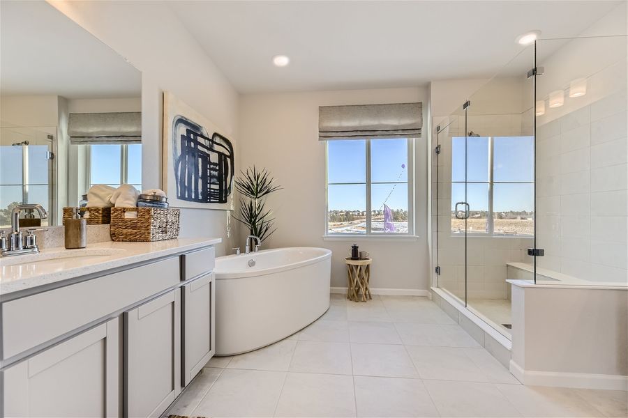 A bathroom with a tub and sink.