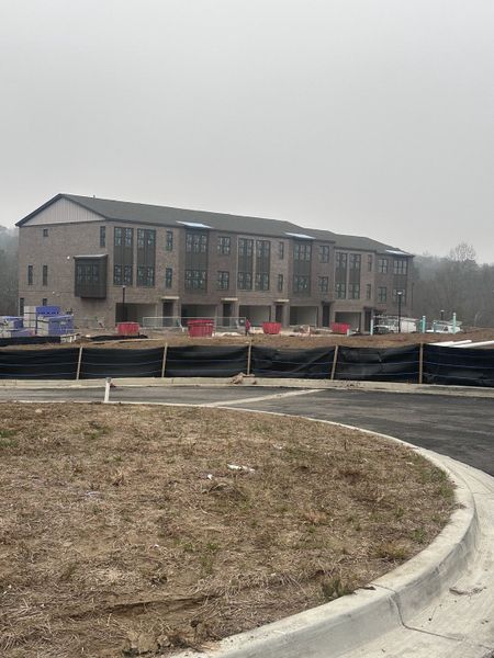 A modern brick apartment complex under construction in Echo Park by UnionMain Homes (Suwanee, GA).