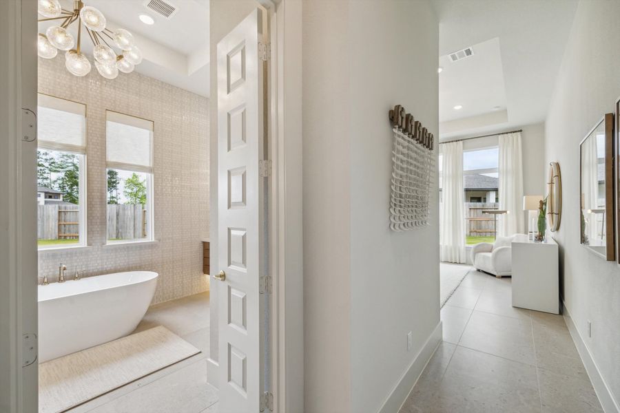 Furnished interior in a model home at ARTAVIA® - 65' Art in Conroe (Image 19).