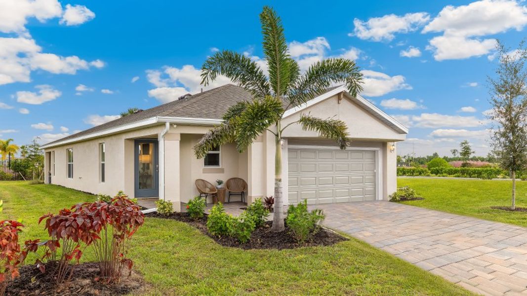 Front exterior of a home in the Cali Cove community, located in Punta Gorda, FL (Image 9).