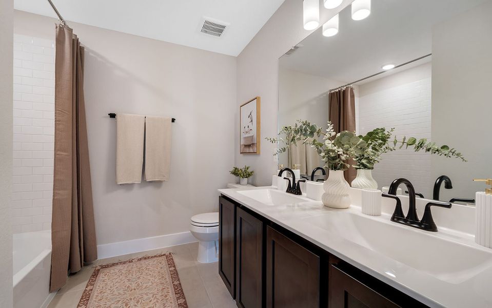 Furnished interior in a model home at Harvest Pointe in Needville (Image 24).