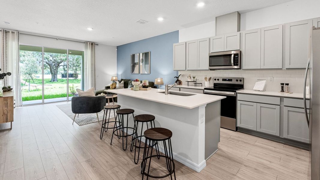 Furnished interior in a model home at Fish Lake Cove in Kissimmee (Image 18).