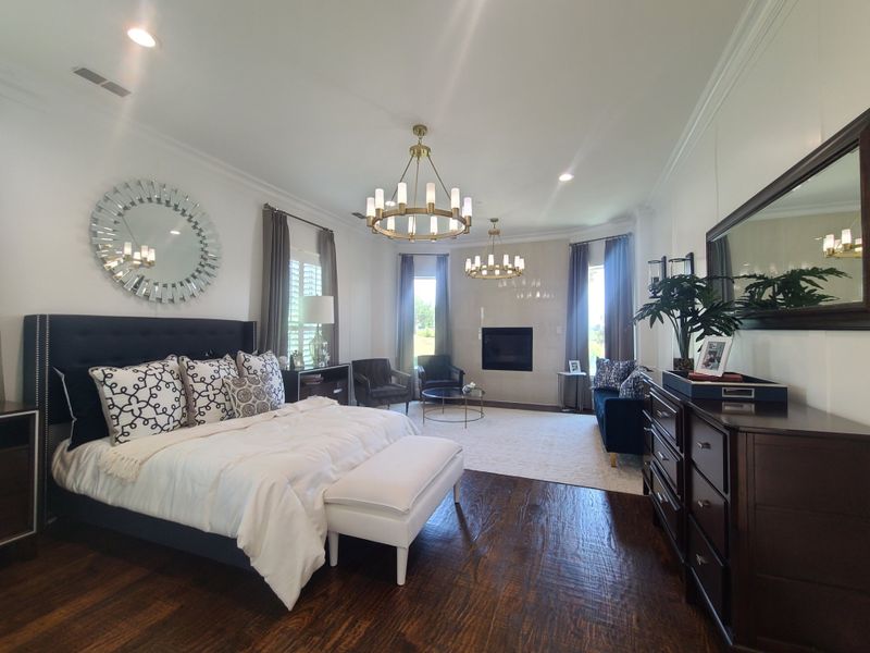 Elegant bedroom with a plush bed, chandeliers, stylish decor, and a cozy fireplace, creating a serene retreat. Elegant bedroom with a plush bed, chandeliers, stylish decor, and a cozy fireplace, creating a serene retreat.