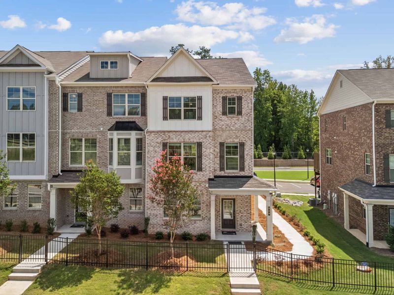 Front exterior of a home in the Towns at Enclave community, located in Lawrenceville, GA (Image 3). Front exterior of a home in the Towns at Enclave community, located in Lawrenceville, GA (Image 3).