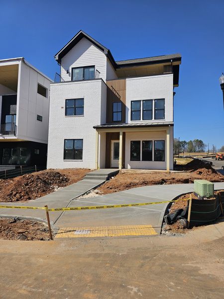 A modern home with a sleek design in The Gathering – Alpharetta by Brock Built (Alpharetta, GA).