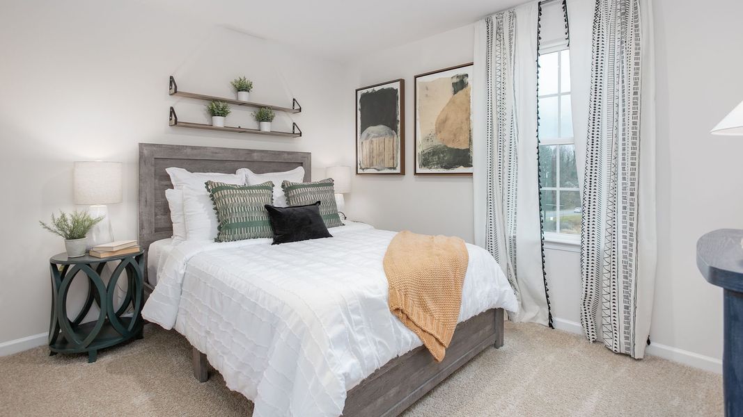 Furnished interior in a model home at Preston Oaks in King (Image 25).