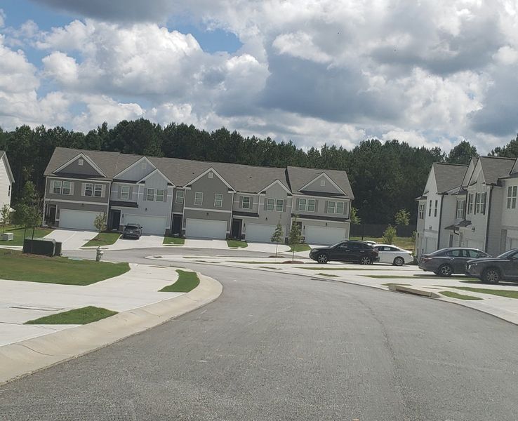 Modern townhouses with green lawns in Sandtown Falls by Rockhaven Homes (Atlanta, GA). Modern townhouses with green lawns in Sandtown Falls by Rockhaven Homes (Atlanta, GA).
