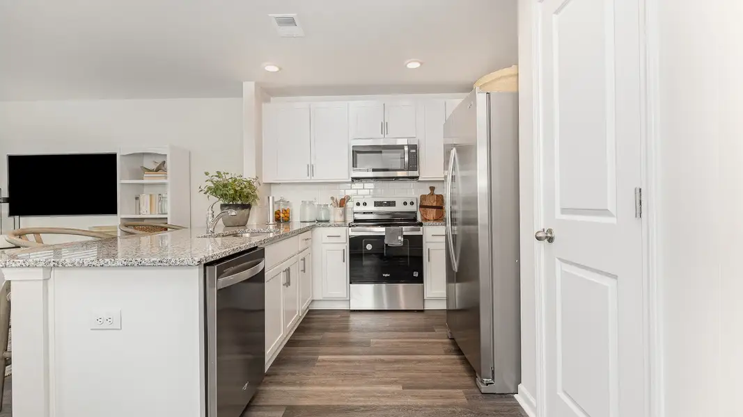 Furnished interior in a model home at The Cove at Glenns Bay in Surfside Beach (Image 5).