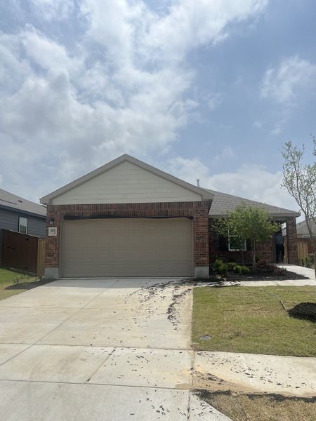 A charming brick home with a spacious driveway in Heartland by KB Home (Heartland, TX). A charming brick home with a spacious driveway in Heartland by KB Home (Heartland, TX).