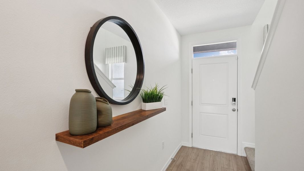 Furnished interior in a model home at Towns at Woodsdale in Wesley Chapel (Image 22).