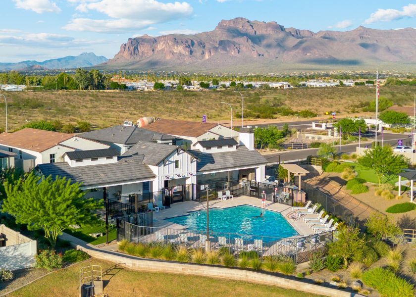 A large building with a pool in the front. A large building with a pool in the front.