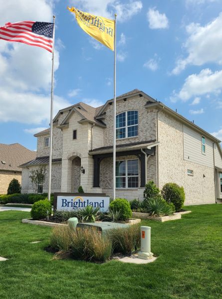 A beautiful two-story brick home with lush landscaping in Anna Ranch by Brightland Homes (Anna, TX). A beautiful two-story brick home with lush landscaping in Anna Ranch by Brightland Homes (Anna, TX).