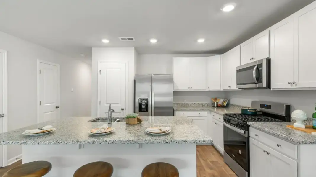 Furnished interior in a model home at Old Bailey Towns in Ridgeland (Image 7).