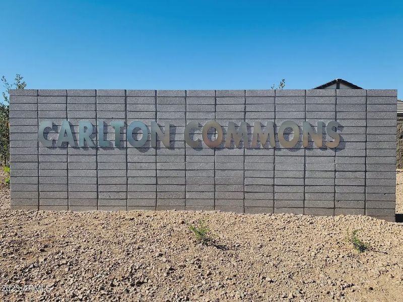 Entrance to the Carlton Commons community in Casa Grande, AZ, featuring signage and landscaping (Image 2).