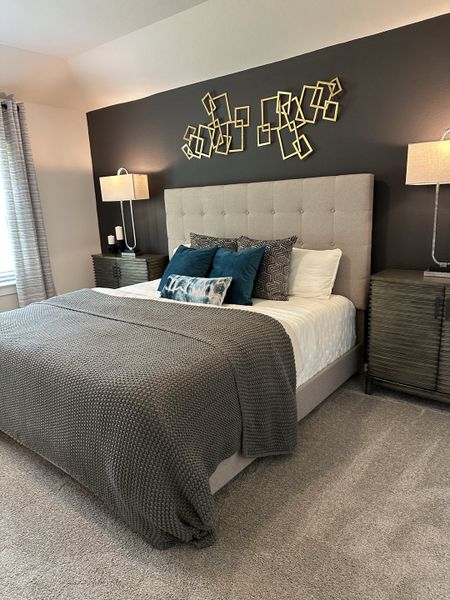 A cozy bedroom with a tufted headboard, modern art, and elegant bedside lamps, creating a serene retreat. A cozy bedroom with a tufted headboard, modern art, and elegant bedside lamps, creating a serene retreat.