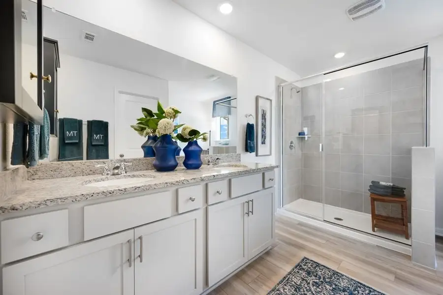 Furnished interior in a model home at Stonewall Ranch 40s in Liberty Hill (Image 36).