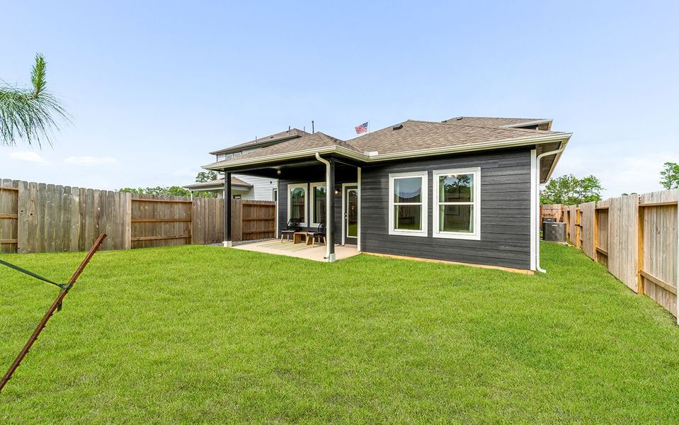 Front exterior of a home in the The Pines at Seven Coves community, located in Willis, TX (Image 10).