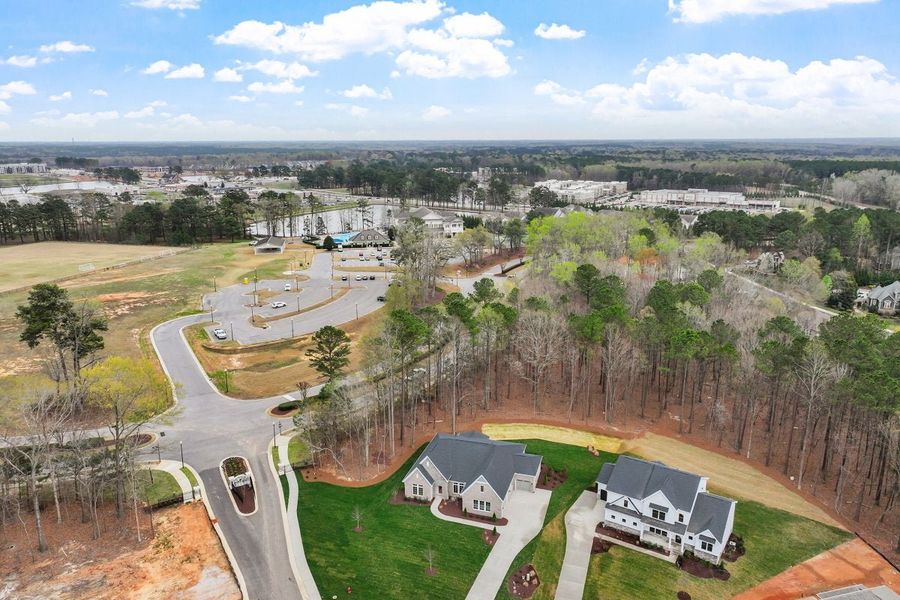 Aerial view of the Watson at Flowers Plantation community in Clayton, NC, showing layout and nearby surroundings (Image 16).