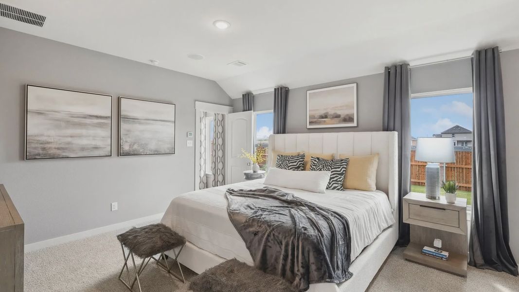 Experience indulgence with plush fabrics and chic decor in this Still Water Lake Estates bedroom.