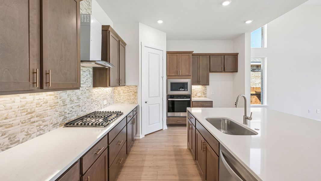 Furnished interior in a model home at The Enclave at Bar W Ranch in Leander (Image 9).