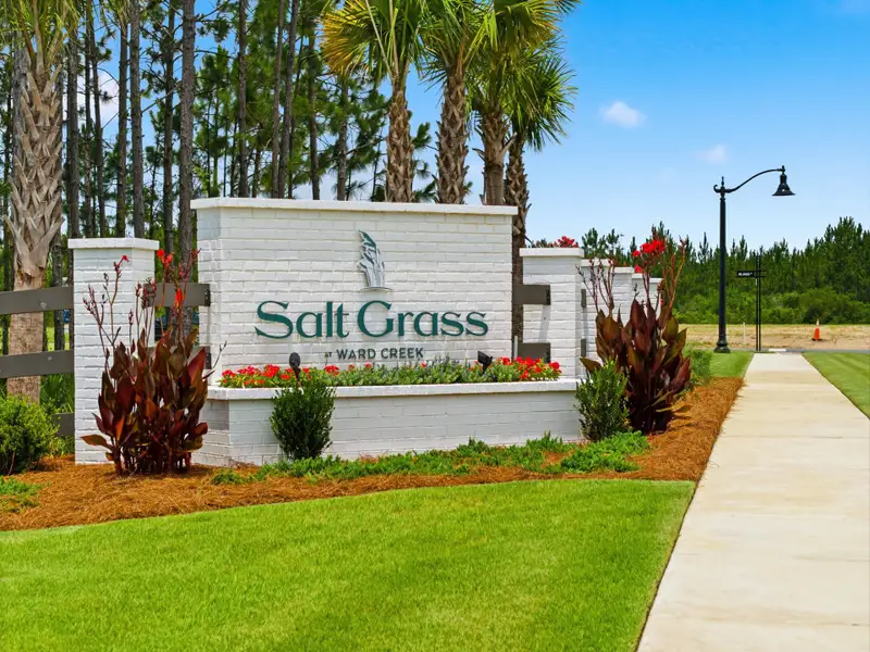 Entrance to the Salt Grass at Ward Creek community in Panama City Beach, FL, featuring signage and landscaping (Image 2). Entrance to the Salt Grass at Ward Creek community in Panama City Beach, FL, featuring signage and landscaping (Image 2).