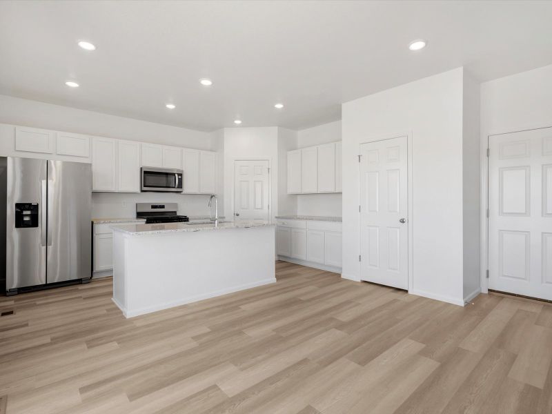 Furnished interior in a model home at Frontier Estates - The Trails Collection in Firestone (Image 15).