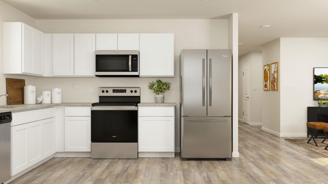 A kitchen with white cabinets. A kitchen with white cabinets.