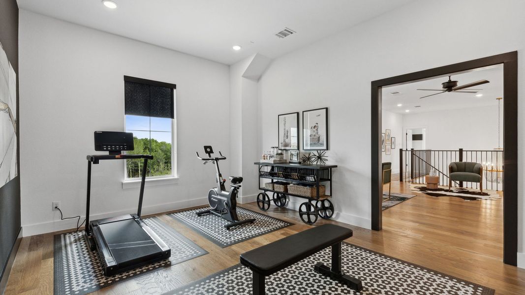 Furnished interior in a model home at Windsong Ranch 71' Series in Prosper (Image 50).