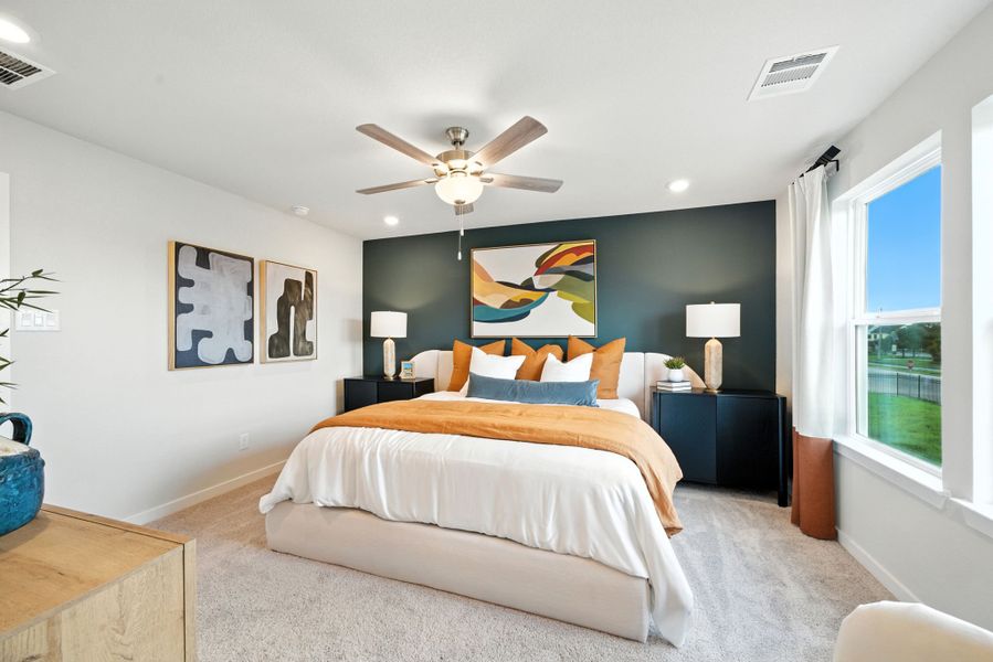 A bedroom with a large bed. A bedroom with a large bed.