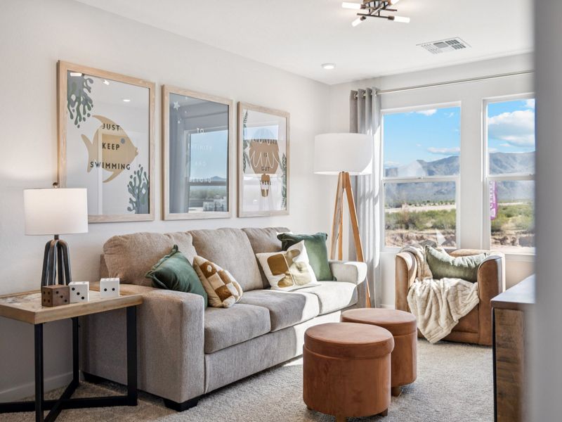 A living room with a large window. A living room with a large window.