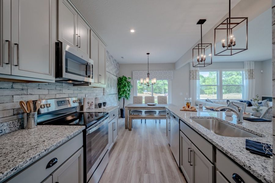 Furnished interior in a model home at Windcrest Farms in Louisville (Image 8).