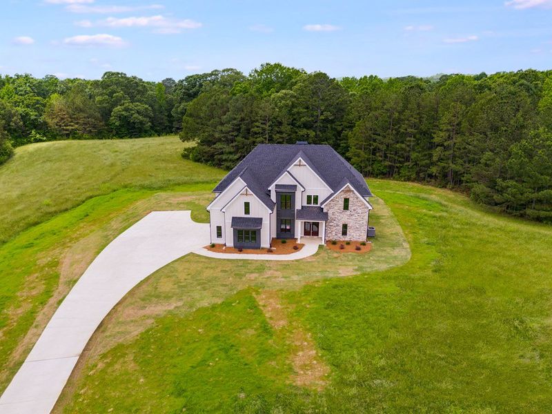 Front exterior of a home in the The Meadows at Lake Circle community, located in Buchanan, GA (Image 1).